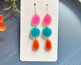 Classic size, resin coated bright ceramic look linked clay earring