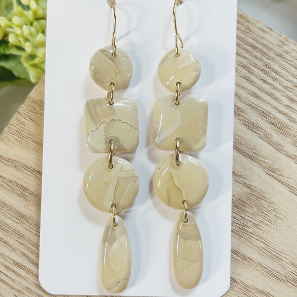 Large size, resin coated cream and marbled clay dangle earring