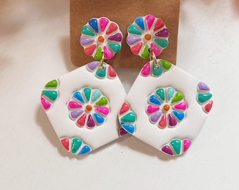 Classic size, embossed and hand painted,  resin coated multi colored clay earring linked to a stud post