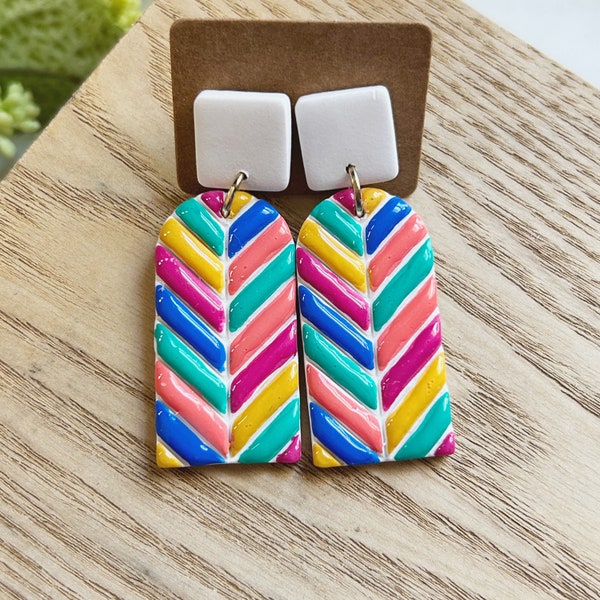 Classic size, hand painted bright multi color chevron clay earring linked to a white square clay stud