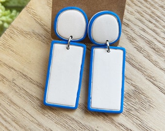 Classic size, light beige linked clay earring with hand painted bright blue edges