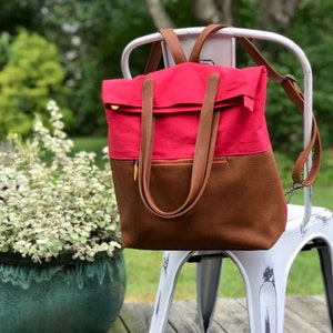 red laptop backpack with canvas and vegan leather, large enough for 15" MacBook laptop