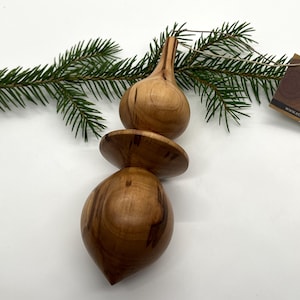 Turned wooden Christmas ornament. Apple wood.