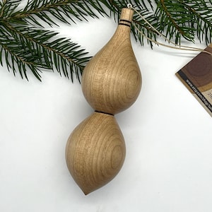 Turned wooden Christmas ornament. Recycled maple wood.