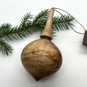 Turned wooden Christmas ornament. Recycled maple wood.