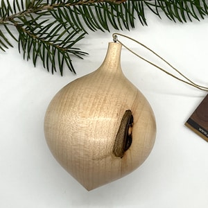 Turned wooden Christmas ornament. Recycled maple wood.