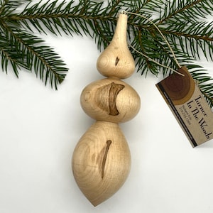 Turned wooden Christmas ornament. Recycled ambrosia maple wood.