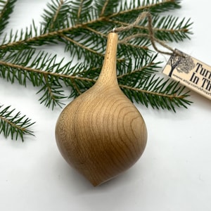 Turned wooden Christmas ornament. Recycled maple wood.
