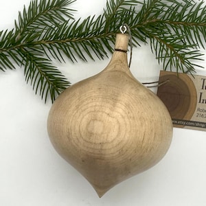 Turned wooden Christmas ornament. Recycled maple wood.