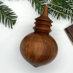 Wooden Christmas ornament.  Turned apple wood.