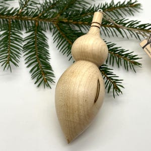 Turned wooden Christmas ornament. Recycled ambrosia maple wood.