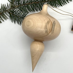 Turned wooden Christmas ornament. Recycled maple wood.