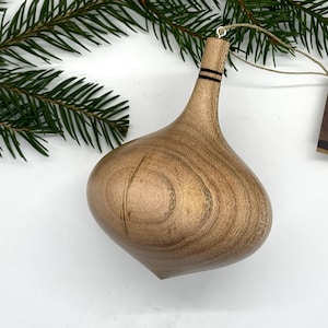 Turned wooden Christmas ornament. Recycled maple wood.