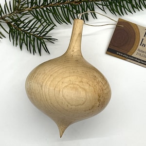 Turned wooden Christmas ornament. Recycled maple wood.
