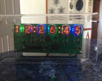 Homemade six-digit Nixie Clock, made with National nixie tubes, RGB led backlighting, user selected.