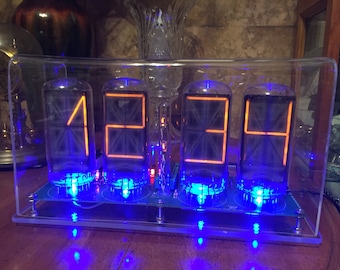 Homemade B7971 Nixie Clock, made with B7971 nixie tubes, RGB led underlighting, user selected.