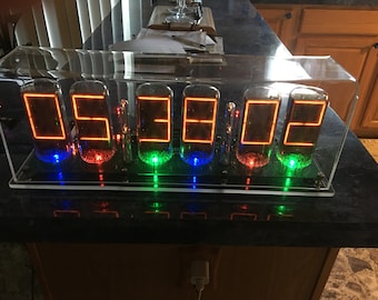 Homemade Six digit B7971 Nixie Clock, made with B7971 nixie tubes, RGB led underlighting, user selected.