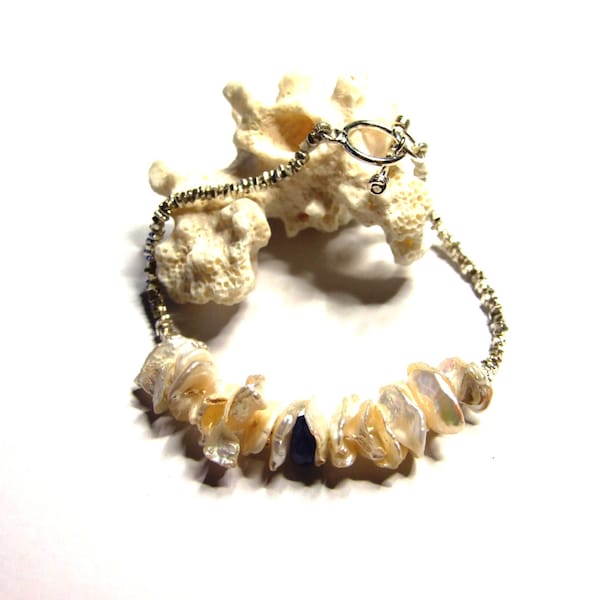 Bracelet - Tanzanite, Cornflake Pearl and Karen Hill Tribe Silver Beads with Sterling Silver Clasp. Hand-knotted with silk.