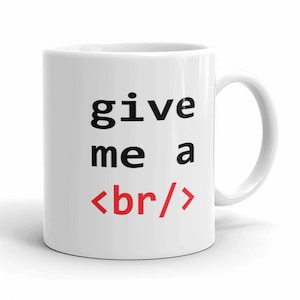 May include: White ceramic mug with black text that reads "give me a <br/>" with the "br" in red. The mug has a black handle.