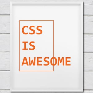 May include: A white framed print with the text "CSS IS AWESOME" in orange letters inside a rectangle.