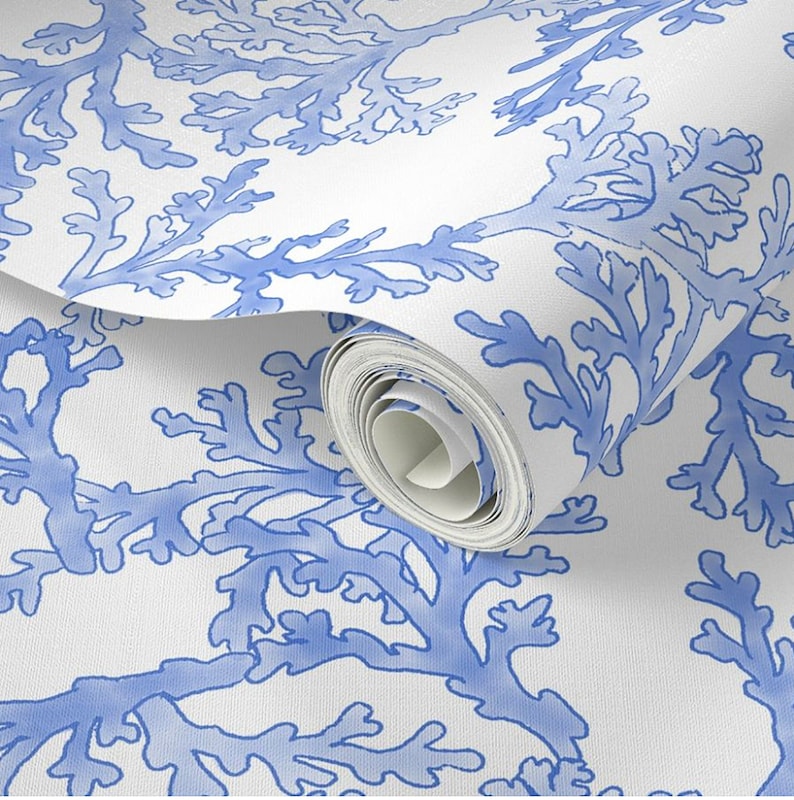Close up of light blue coral peel and stick wallpaper roll.