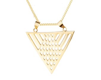 May include: A gold necklace with a geometric triangle pendant. The pendant has a delicate, openwork design.