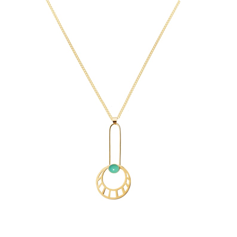 May include: A gold necklace with a pendant featuring a green gemstone set in a circular frame with geometric cutouts.