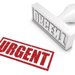 May include: A red rubber stamp with the word "URGENT" in white letters. The stamp is on a white surface and there is a white rubber stamp with the word "URGENT" in black letters above it.