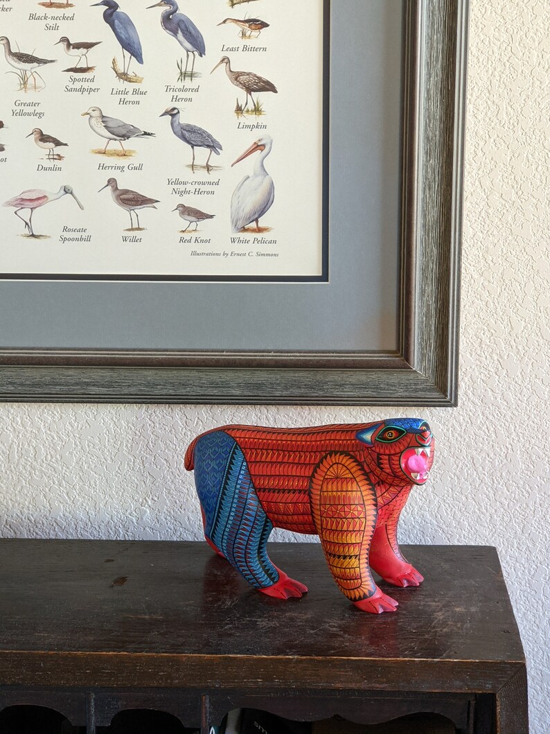 5.5 Inches in Height Original Handmade, Hand Painted Animal, Wood Carving with Irate Eyes, Copper Colored Tail, Colorful Patterned Body, Blue Colored Hind legs, Bear Alebrije, Oaxaca Art, Unique Statue from https://luv2brd.com