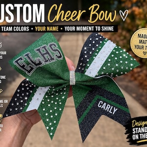 May include: A custom cheer bow in green, black, and white with rhinestone accents. The bow features the text "FLHS" and "CARLY". The text "CUSTOM Cheer Bow" and "Designed to STAND OUT ON THE MAT" are also visible.