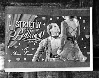 May include: Black and white fan art print for the movie "Strictly Ballroom." The print features the movie title, the director's name, and the phrase "A Fan Zine." The image shows two people dancing, with decorative hearts and stars.