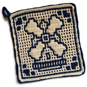 May include: A beige crocheted pot holder with a blue border and a geometric design in the center.