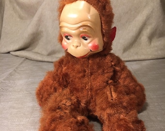 Orangután de 33 cm con máscara de plástico, ¿años 60? Algunos daños.