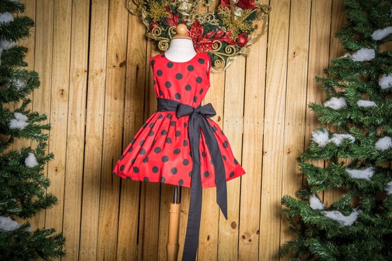 Red dress with black shop polka dots