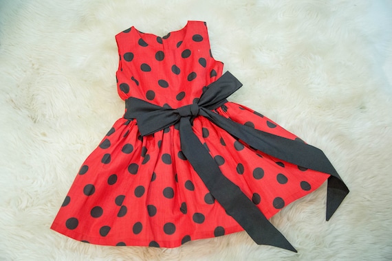 red dress with black polka dots