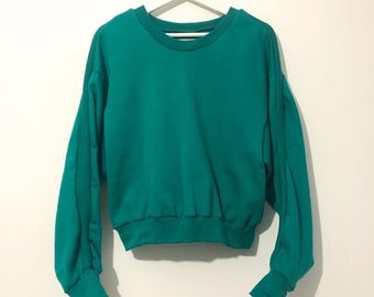 Smaragdgroen fleecesweater: geribbeld detail, boxy-pasvorm