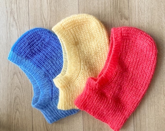 Handgebreide bivakmuts van mohair: pluizige wintermuts