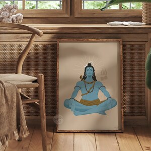 May include: A framed art print featuring a blue-skinned figure with dark hair, a crescent moon, and a snake around the neck, sitting in a meditative pose. The figure wears a gold cloth and holds a trident, set against a light tan background.
