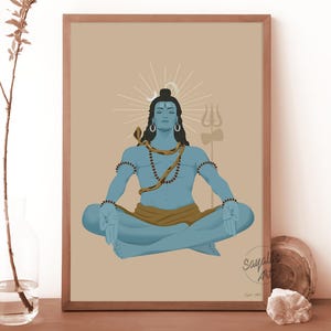 May include: A framed digital art print featuring a blue-skinned deity in a meditative lotus position. The figure wears a brown cloth, a snake around the neck, and beads. A trident stands behind, with a sunburst halo and the text Sayali's Art.