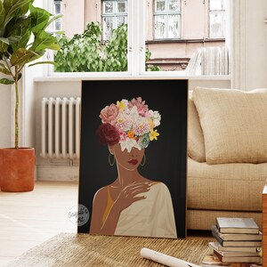 May include: A digital illustration of a woman with a crown of flowers covering her face. The flowers are pink, white, yellow, and red. The woman is wearing a gold necklace and a white shawl. The background is black.