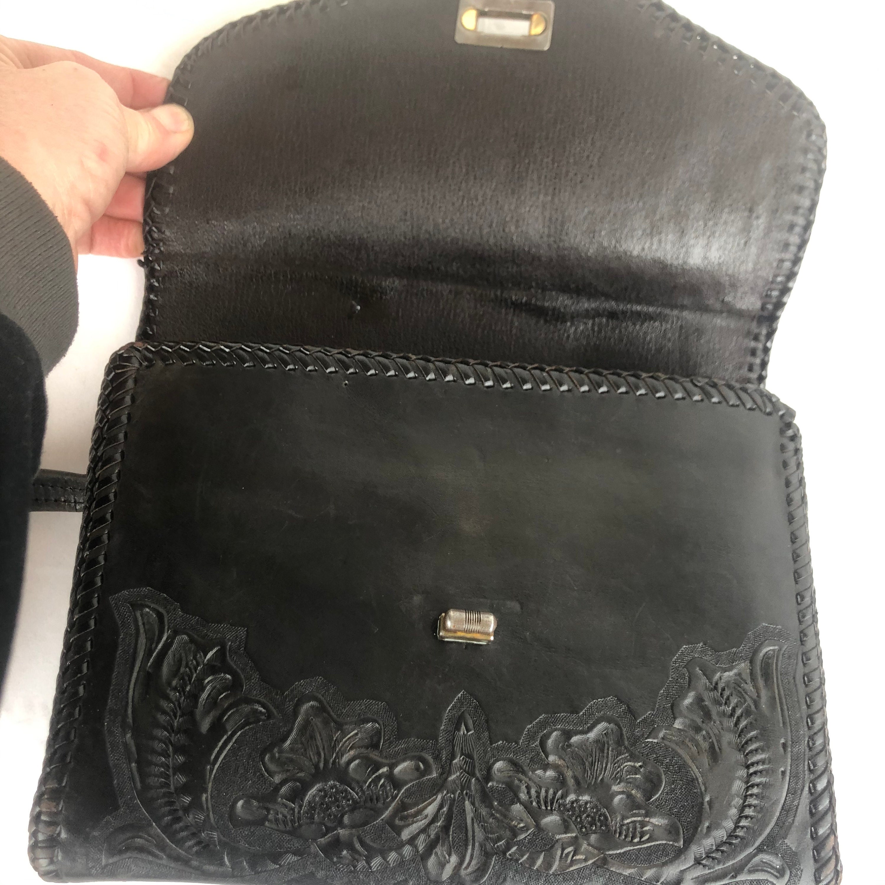 black tooled leather bag