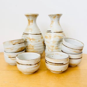 Japanese Pottery Sake Set, Two Sake Bottles & 6 Cups