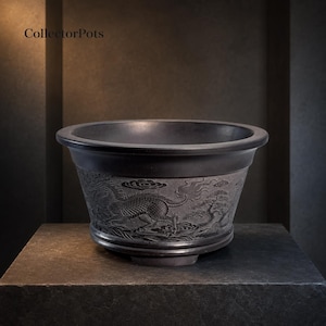 Fin Yixing svart Zisha lera rund bonsai-kruka med lyckosam Qilin lågreliefdesign
