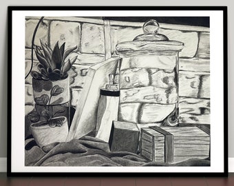 May include: A black and white pencil drawing of a still life featuring a glass jar with a lid, two potted plants, a book, and two boxes on a fabric surface.