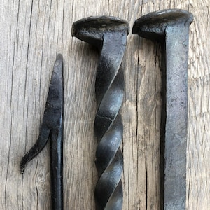 All metal hand forged fire poker. Made from a railraod spike handle welded to a hand forged fire poker. Three different style: straight, twisted and stairstep. Twisted and straight handles pictured here with the fire poker end.