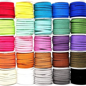 May include: A selection of colourful suede cords in a variety of shades, including red, yellow, blue, green, pink, orange, brown, and black. Each cord is neatly wound on a spool, offering a wide range of options for crafting and jewellery making.