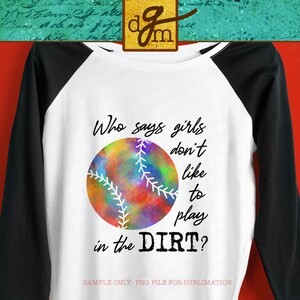 May include: White and black baseball raglan shirt with a colorful baseball graphic. The baseball has a watercolor design with the text "Who says girls don't like to play in the DIRT?" printed on the front.