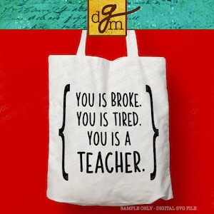 May include: White tote bag with black text that reads "You is broke. You is tired. You is a teacher."