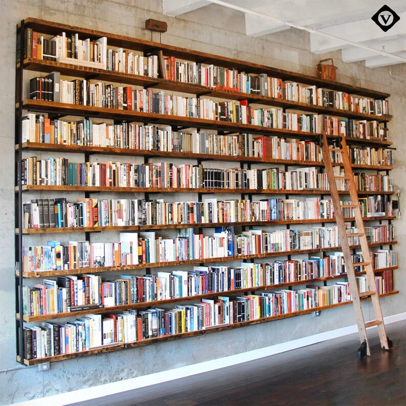 A large custom wall mounted shelving unit perfect for library or heavy book storage. Vautl furniture offers industrial strength steel brackets and solid premium hardwoods to ensure top quality and durability. All made in teh USA.