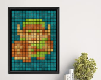May include: A framed pixel art print of a video game character. The character is green and brown and is set against a blue background.